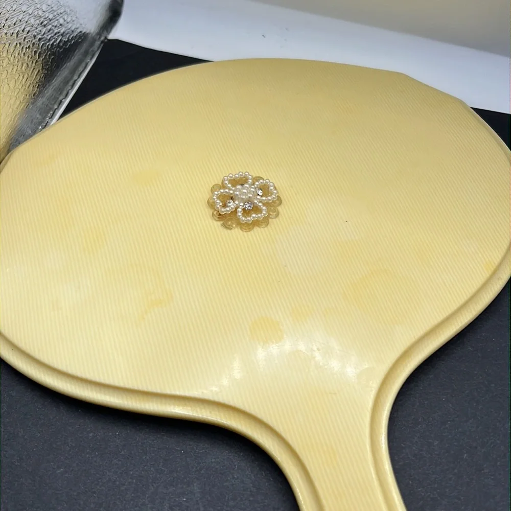 French Ivory 1950’s celluloid hand mirror and comb set